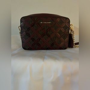 Burgundy Michael Kors purse .